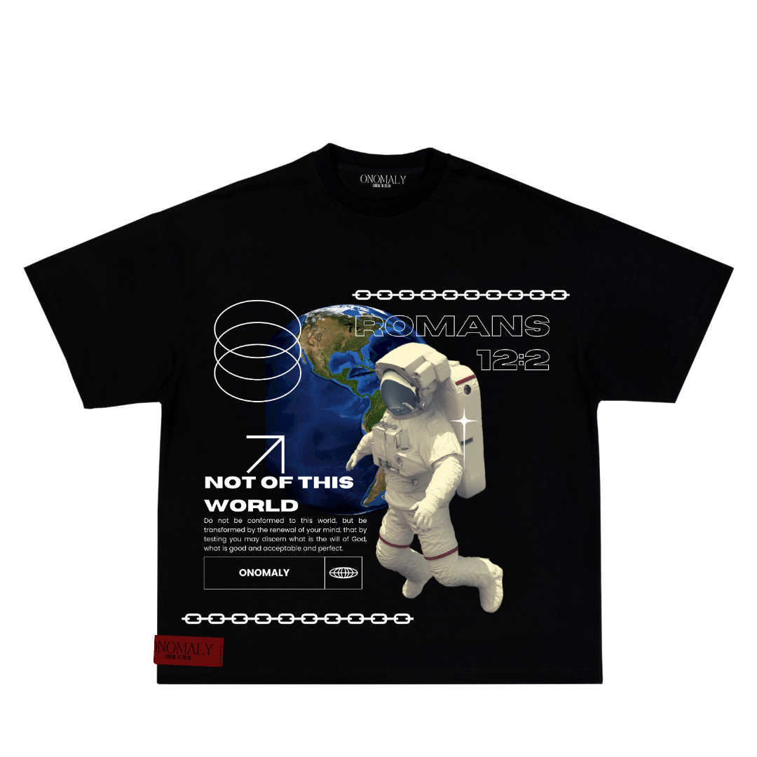 Black Christian streetwear T-shirt featuring a graphic of an astronaut floating in space above Earth, with the verse 'Romans 12:2' and the phrase 'Not of This World' printed in bold white text. Design includes modern elements like chain and orbit symbols, with the ONOMALY logo at the bottom.